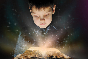 Boy is reading a magic book