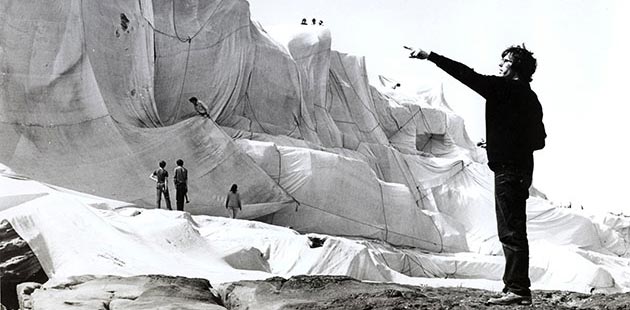 Christo directs workers and volunteers to create Wrapped Coast - One Million Square Feet, Little Bay, Sydney, Australia (1968 - 69) - photo by Harry Shunk