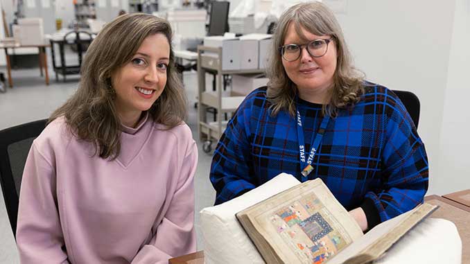 Fellow-Dr-Sofi-Basseghi-and-Senior-Librarian-Dr-Anna-Welch-with-a-rare-Persian-manuscripts-courtesy-of-State-Library-Victoria